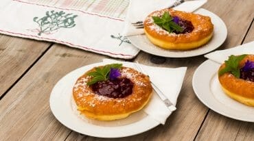 a plate of food sitting on top of a wooden table